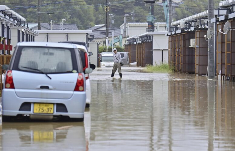 Rescue workers search for at least 6 people missing  after heavy rain pounds Japan’s Noto region